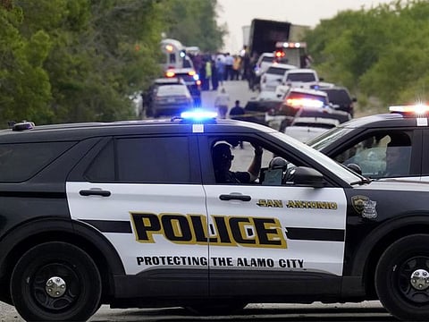 Police block the scene where a semitrailer with multiple dead bodies was discovered on Monday, June 27, 2022, in San Antonio.