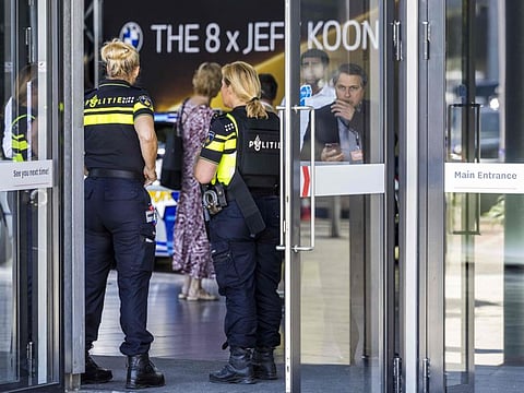 Dutch police officers stand guard at the entrance of the TEFAF Art Fair in Maastricht on June 28, 2022, following a robbery.
