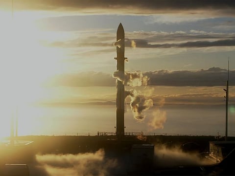 In this photo released by Rocket Lab, Rocket Lab's Electron rocket sits on the launch pad on the Mahia peninsula in New Zealand on May 17, 2022.