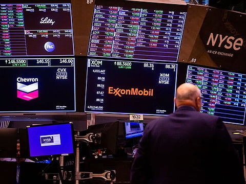 Chevron Corp. and Exxon Mobil Corp. signage on the floor of the New York Stock Exchange (NYSE) in New York, U.S., on Monday, June 27, 2022. 