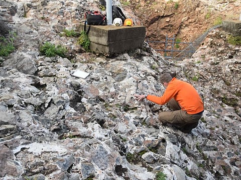 An undated handout photograph released by the French National Centre for Scientific Research (CNRS) shows researchers collecting samples at a dig-site around the caves in Sterkfontein, also knows as the "Cradle of Humankind" and home to the discovery site of Australopithecus pre-human skeletal remains, northwest of Johannesburg, South Africa.