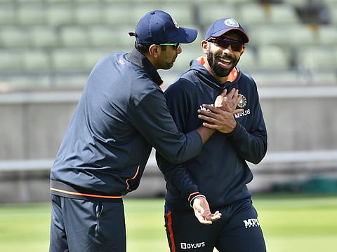 Newly appointed captain Jasprit Bumrah (right) share a light moment with teammate Ravichandran Ashwin ahead of the fifth Test against England at Edgbaston in Birmingham.