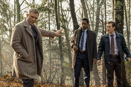 This image released by Lionsgate shows Daniel Craig, from left, Lakeith Stanfield and Noah Segan in a scene from "Knives Out."