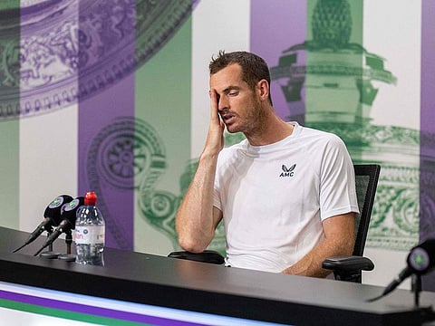 Down, but still not out: Andy Murray after his second round loss to John Isner at the Wimbledon on Wednesday.
