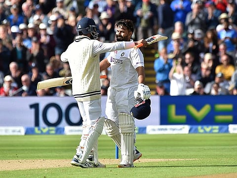 Counter-attack: Rishabh Pant (right) receives a hug from senior partner Ravindra Jadeja on reaching his century. 