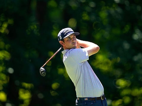 Early leader J.T. Poston hits off the sixth tee during the first round of the John Deere Classic golf on Thursday. 