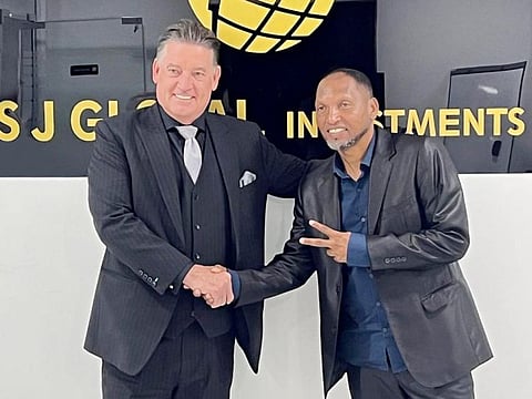 S J Group Managing Director Neil Walsh with the legendary Brazilian Football Player Macedo