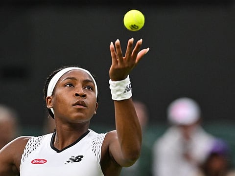 US player Coco Gauff serves the ball to Romania's Mihaela Buzarnescu during their women's singles match on the fourth day of the Wimbledon Championships.