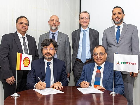 Shell's Azmat Jafri (left) and Tristar's Eugene Mayne (right) with standing (from left to right) Balaji Nagabhushan, Raed Al Souki and Marco Bachechi of Tristar, and Marwan Ramadan of Shell