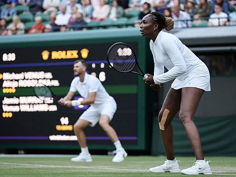 Venus Williams (right) and Jamie Murray in action against Michael Venus and Alicja Rosolska during their mixed doubles tennis match on the fifth day of the 2022 Wimbledon Championships at The All England Tennis Club in Wimbledon, southwest London.
