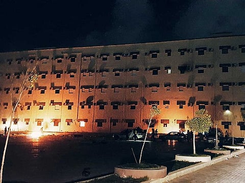This picture taken early on July 2, 2022 shows a view of the building used by Libya's Tobruk-based parliament building in the country's east, lit up by protesters who broke inside while demonstrating against deteriorating living conditions and political deadlock.
