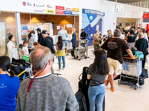 Queues of passengers in the departure hall during a strike by airport workers at Charles de Gaulle airport in Paris, France, on Saturday, July 2, 2022.