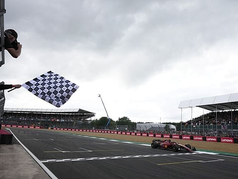 Ferrari's Carlos Sainz Jr. crosses the line to win the British Grand Prix at Silverstone.