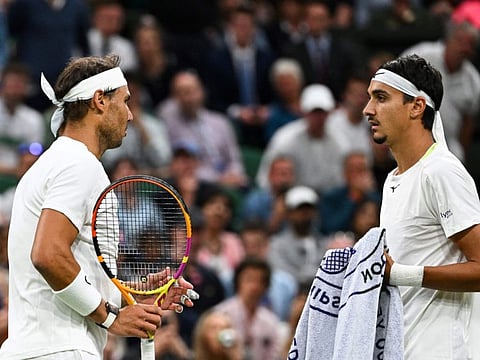 Spain's Rafael Nadal (left) has a discussion with Italy's Lorenzo Sonego during their men's singles tennis match on the sixth day of the 2022 Wimbledon Championships at The All England Tennis Club in Wimbledon, southwest London.
