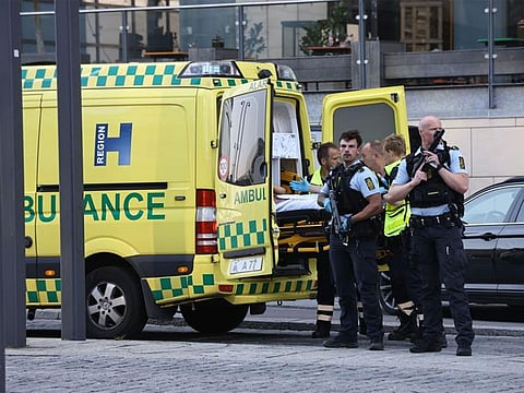  An ambulance and armed police outside the Field's shopping center, in Orestad, Copenhagen, Denmark, Sunday, July 3, 2022, after reports of shots fired.