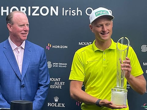 Dubai-based Adrian Meronk (right) receiving his Horizon Irish Open trophy for his win.