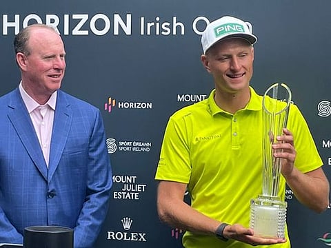 Dubai-based Adrian Meronk (right) receiving his Horizon Irish Open trophy for his win.