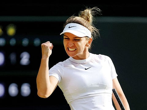 Romania's Simona Halep celebrates after winning her fourth round match against Spain's Paula Badosa.