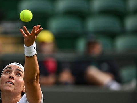 Tunisia's Ons Jabeur serves to Belgium's Elise Mertens during their round of 16 women's singles match on Sunday.