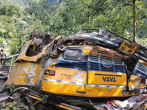 This photograph provided by Deputy Commissioner's office, Kullu, shows the wreckage of a passenger that bus slid off a mountain road and fell into a deep gorge near Kullu, Himachal Pradesh state, India, on July 4, 2022. 