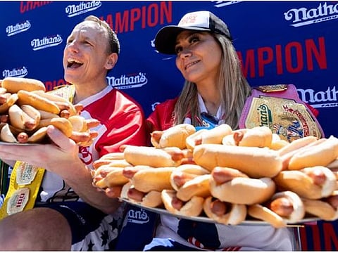 Chowdown: He ate 63 hot dogs in 10 minutes, she ate 40