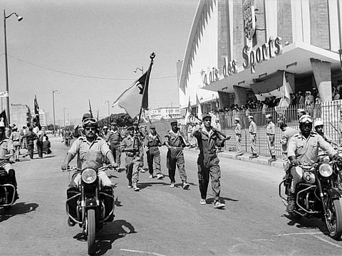 Algerian troops of the National Liberation Army (ALN) parade in front of the Palais de Sports in Oran, during a ceremony celebrating Algeria's independence in July 3, 1962 photo. 