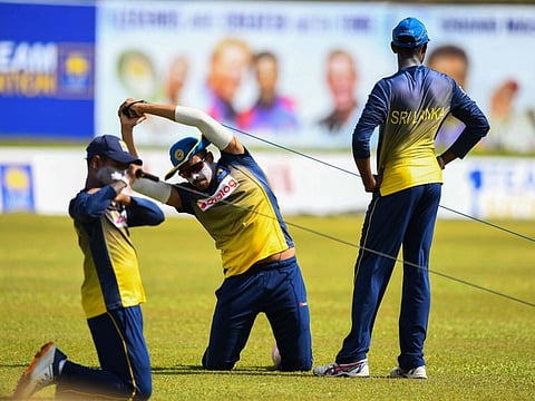 Sri Lanka's Maheesh Theekshana (centre) attends a practice session at the Galle International Cricket Stadium on Wednesday, ahead of the second Test beginning on Friday.