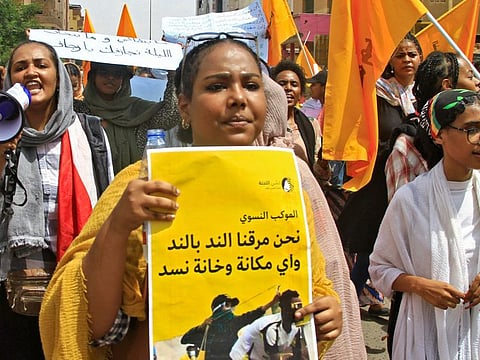 Sudanese women take to the streets of the capital Khartoum, as they join the ongoing protests against military rule, on July 6, 2022. 