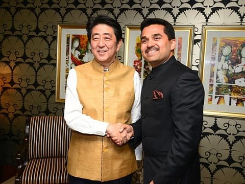 Dr Shamsheer Vayalil with former Japanese Prime Minister Shinzo Abe after gifting him the golden jacket during Abe's visit to India in 2015. 