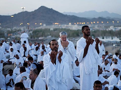 Pilgrims gather on Mount of Mercy at the plain of Arafat during the Hajj pilgrimage, outside the holy city of Mecca, Saudi Arabia, July 8, 2022.