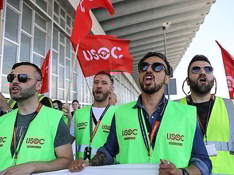 Spanish EasyJet and Ryanair Holdings Plc workers strike in pay dispute.