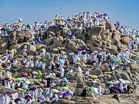 Pilgrims gather atop Mount Arafat, also known as Jebel Al Rahma (Mount of Mercy), southeast of Mecca, on July 8, 2022. 