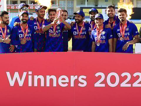India's players pose with the trophy during a presentation after winning the '3rd Vitality IT20' Twenty20 International cricket match between England and India at Trent Bridge in Nottingham, central England on July 10, 2022. (Photo by Lindsey Parnaby / AFP) / RESTRICTED TO EDITORIAL USE. NO ASSOCIATION WITH DIRECT COMPETITOR OF SPONSOR, PARTNER, OR SUPPLIER OF THE ECB