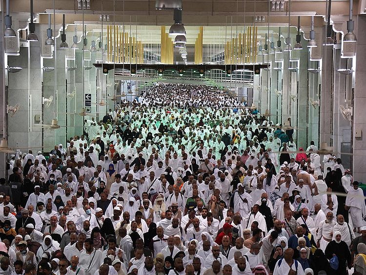 Worshippers arrive to circumambulate the Kaaba, at the Grand mosque in Mecca. 