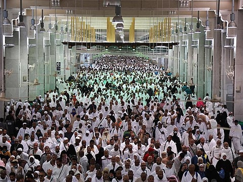 Worshippers arrive to circumambulate the Kaaba, at the Grand mosque in Mecca. 