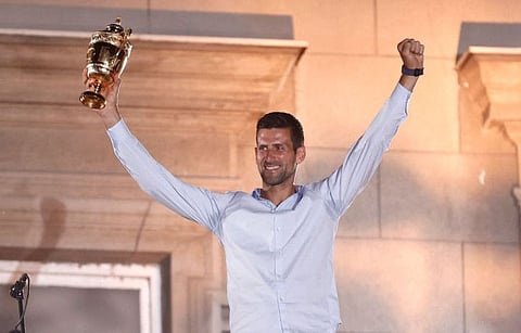 Serbia's Novak Djokovic celebrates his victory at the Wimbledon tennis tournament with supporters during a welcoming ceremony in Belgrade on Tuesday.