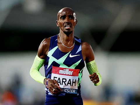 Britain's Mo Farah reacts after the Men's 10,000m at British Athletic Championships on June 25, 2021 as he fails to qualify for the 10,000m at the Tokyo Olympics Action