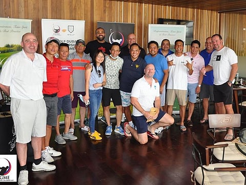 The FIGME Golf Society Group at Al Zorah Golf Club in Ajman pose with Sam Bahl, Managing Director of Business Development, MyGolf Dubai.