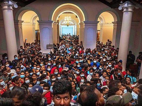 File photo: People throng President Gotabaya Rajapaksa’s official residence in Colombo, Sri Lanka, Monday, July 11, 2022. Sri Lanka is grappling with the worst economic crisis in more than seven decades, with more than a quarter of its population struggling with food shortages, according to United Nations estimates.