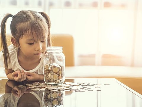 Want to teach your children financial literacy? Here's how you can open a bank account for them.