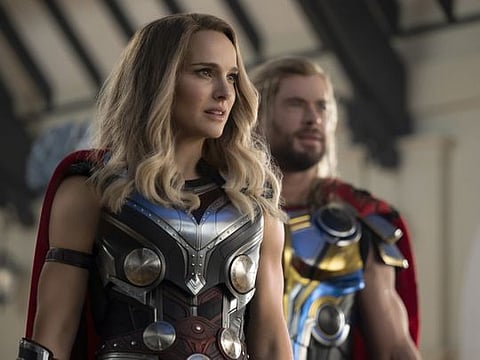 Natalie Portman, left, and Chris Hemsworth in "Thor: Love and Thunder." 
