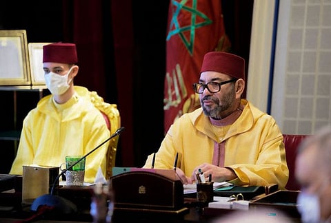 Morocco's King Mohammed VI  chairs a meeting of council of ministers accompanied by his son Prince Moulay Hassan, at the Royal Palace in the capital Rabat on Wednesday..  