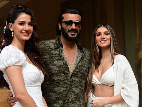 Bollywood actors Disha Patani, Arjun Kapoor and Tara Sutaria pose for pictures during the promotion of their upcoming Hindi-language action thriller film Ek Villain Returns in Mumbai on July 14, 2022.