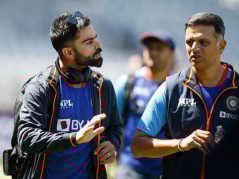 Virat Kohli and head coach Rahul Dravid in a discussion during India's practice session at Old Trafford in Manchester ahead of the third and final ODI.