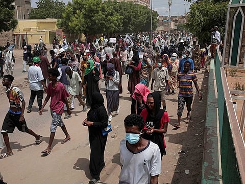 Sudanese demonstrators take to the streets calling for civilian rule and denouncing the military administration, in Khartoum, Sudan, Sunday, July 17, 2022. 