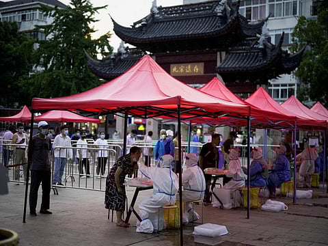 People line up to get tested for the coronavirus disease (COVID-19) at a nucleic acid testing site, following the coronavirus disease (COVID-19) outbreak, in Shanghai China July 12, 2022.