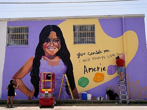 Artists work on a mural to honour Amerie Jo Garza, a student who was killed in the shootings at Robb Elementary school last month, Sunday, July 17, 2022, in Uvalde, Texas.
