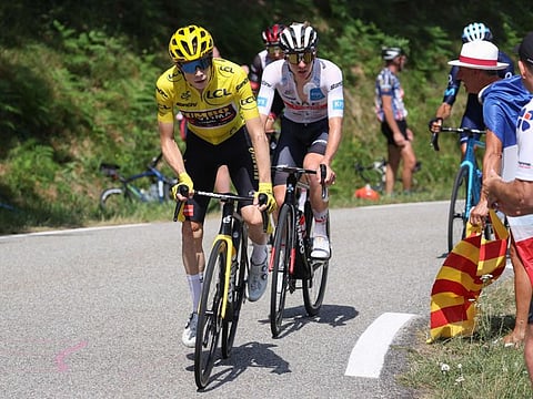 UAE Team Emirates team's Tadej Pogacar (behind) and Jumbo-Visma team's Jonas Vingegaard (left) in close contest during an ascent in the 16th stage of Tour de France on Tuesday.