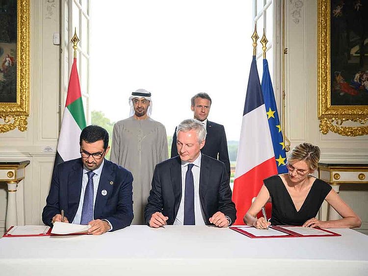 Sheikh Mohamed and Emmanuel Macron witness an MOU signing ceremony, at the Versailles Grand Trianon. 