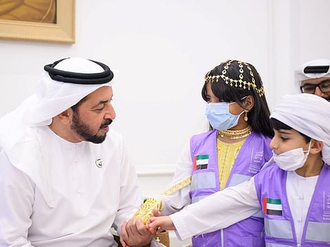 Sheikh Hamdan bin Zayed Al Nahyan interacts with ERC volunteers at Al Nakheel Palace.  